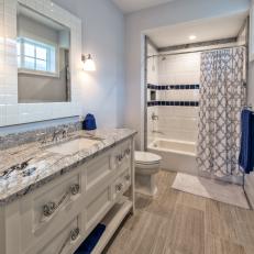 Blue and White Guest Bathroom With Shower Curtain