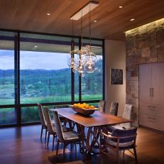 Dining Room With Wood Paneling and View