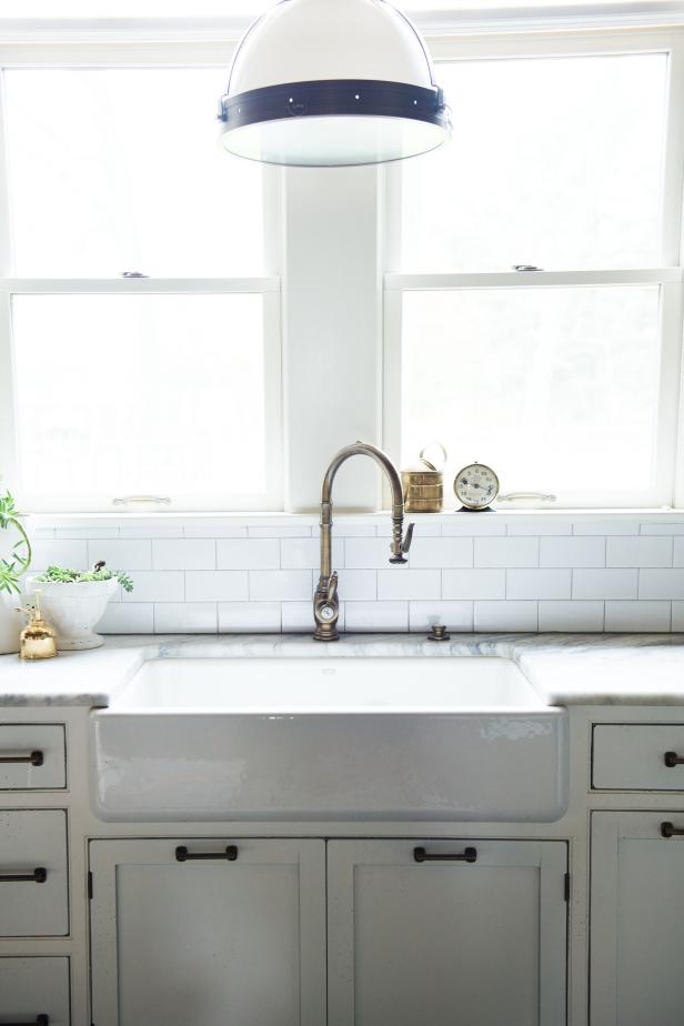 Farmhouse Sink and White Pendant Light in Remodeled Kitchen | HGTV