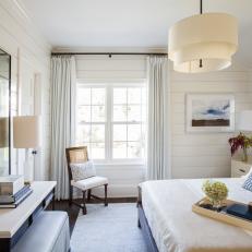 Blue and White Transitional Bedroom With Paneling