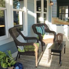 Contemporary Blue Porch with Brown Wicker Chairs 