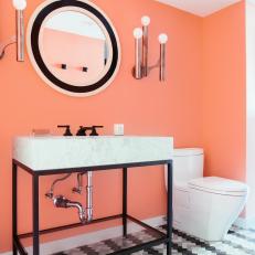 Bold, Neon Pink Bathroom With Striped Tile Flooring