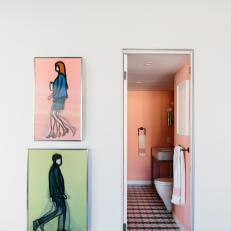 Modern Art Near Door to Small Peach Bathroom
