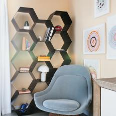 Sitting Area With Modern Chair and Hexagonal Shelf System
