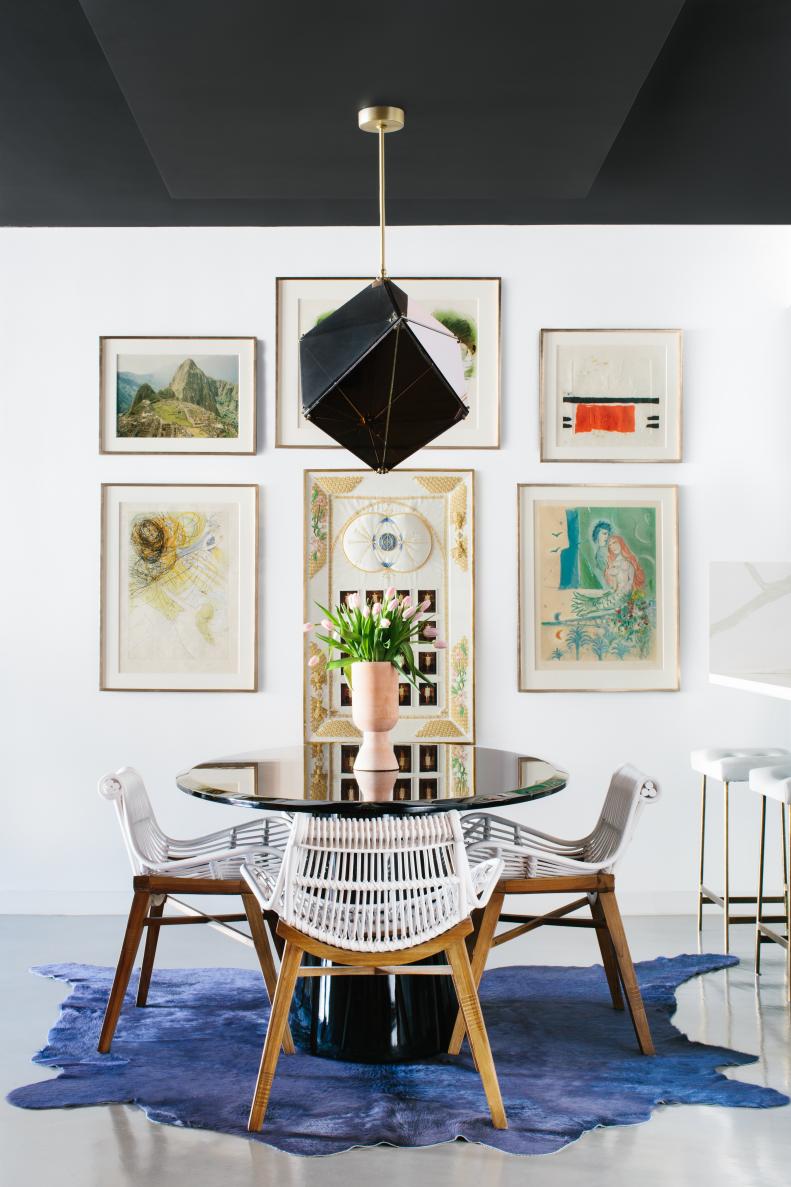 Eating Area With Round Black Table and Modern Geometric Pendant Light