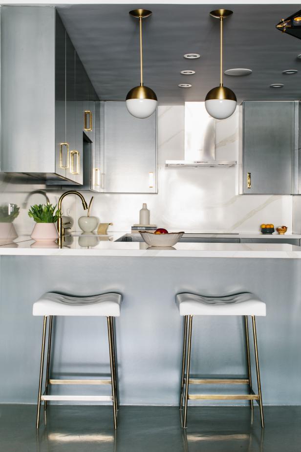 Modern Gray Kitchen With Pendant Lights and White Barstools | HGTV