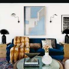 Modern Living Room With Blue Sofa, Red Rug and Fur Throw