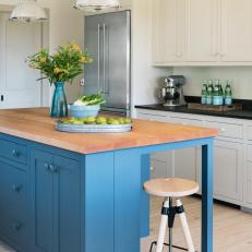 Blue Island Stands Out in White Farmhouse Kitchen