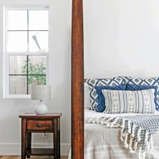 Bright Master Bedroom With Wood Framed Bed