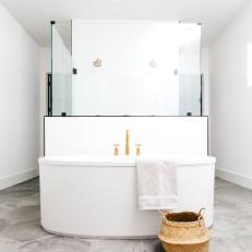 White Tub With Gold Fixtures in Master Bath
