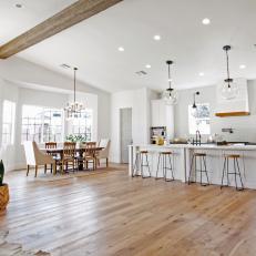 Bright Eat In Kitchen With Exposed Barn Wood Beam