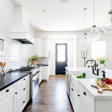 Black Side Door Brings Natural Light Into the Kitchen Space