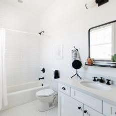 Black and White Bathroom with Matte Black Finishes