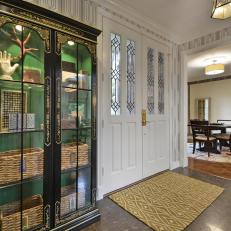 Entrance With Black and Gold Glass Cabinet