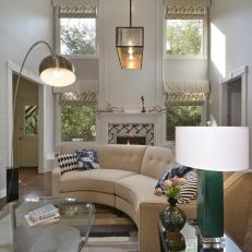 Eclectic Living Room With Neutral Couch and Glass Coffee Table