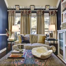 Eclectic Living Room With Cushioned Ottoman