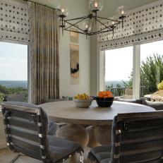 Breakfast Nook With Wood Table and Gray Cushioned Chairs