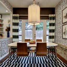 Art Deco Dining Room With Exposed Brick