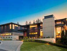 Contemporary Luxury Home With Large Windows at Dusk
