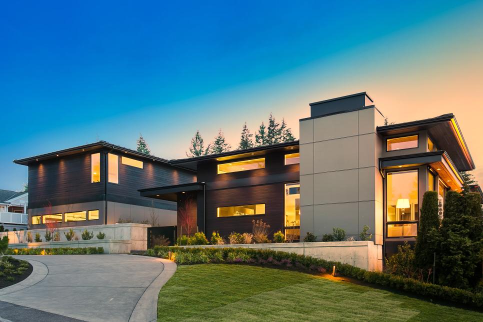 Contemporary Luxury Home With Large Windows at Dusk