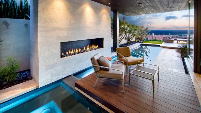 Covered Modern Outdoor Space With Pool and Fireplace