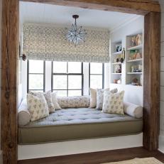 Large, Cushioned Window Nook With Natural Wood Frame, Star Pendant Light and Patterned Roman Shade