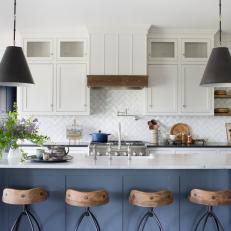 Bright Farmhouse Kitchen with Blue Island Accent and White Tile Backsplash 