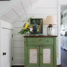 White Shiplap Walls and Distressed Green Cabinet Tucked in Under-stair Cubby 