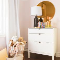 Pink Girl's Room With Toy Basket