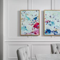 Colorful Art in Gold Frame on White Wall