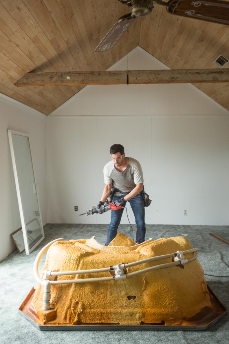 Host Drew Scott takes out the hot tub in the master bedroom, as seen on Brother vs. Brother.