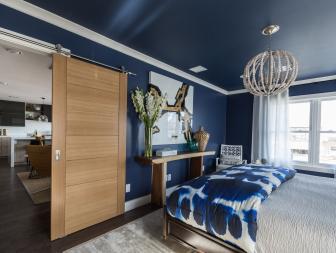 The master bedroom in Jonathan Scott's renovated house features a sliding door, as seen on Brother vs. Brother. (After #5)