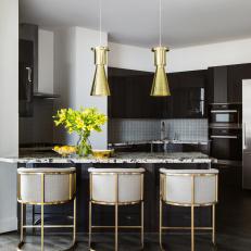 Black Open Kitchen With Yellow Lilies