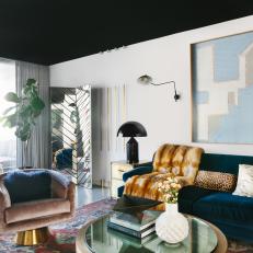 Modern Living Room With Blue Sofa and Animal Print Pillows