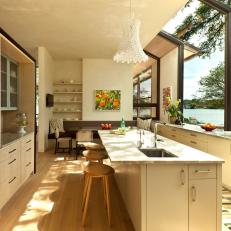 White Galley Kitchen With Lake Views