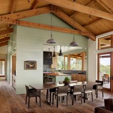 Rustic Dining Room With Industrial Pendant Lights