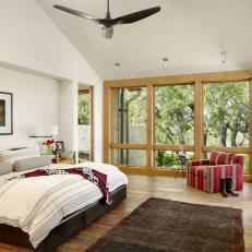 Contemporary Bedroom With Red Armchair