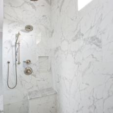 Standing Shower With Marble Tiling and a Frosted Glass Panel
