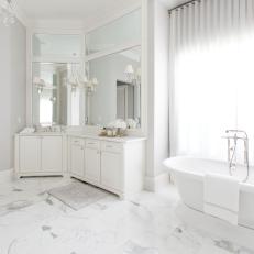 All-White Transitional Master Bathroom With Marble Tile Flooring