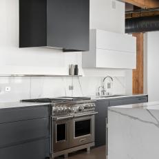 Black and White Modern Open Kitchen With Wolf Range