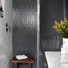 Tall Glass Shower With Black Tiling