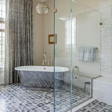 Master Bath Features Geode Print Curtains, Orb Pendant Light, Silvery Tub 