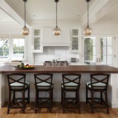 White Open Kitchen With Silver Pendants