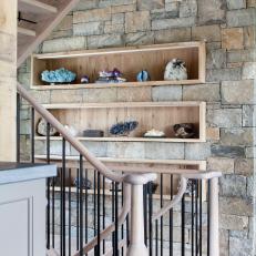 Stairwell With Stone Wall and Shelves