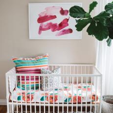 Eclectic Neutral Nursery With Striped Pillow