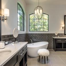 Black and White Master Bathroom With Modern Tub