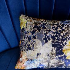 Patterned Pillow and Blue Seat