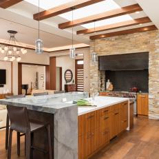 Open Transitional Kitchen With Skylight Beams, Marble Island Top and Teak Cabinetry