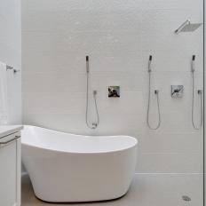 Monochromatic White Modern Bathroom With Smooth Tub, Textured Tile and Glass Shower