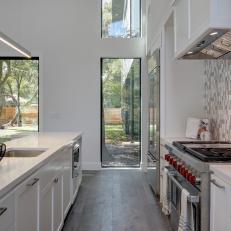 Modern Bright Kitchen With Tile Backsplash, Long Island Accent Stove Knobs
